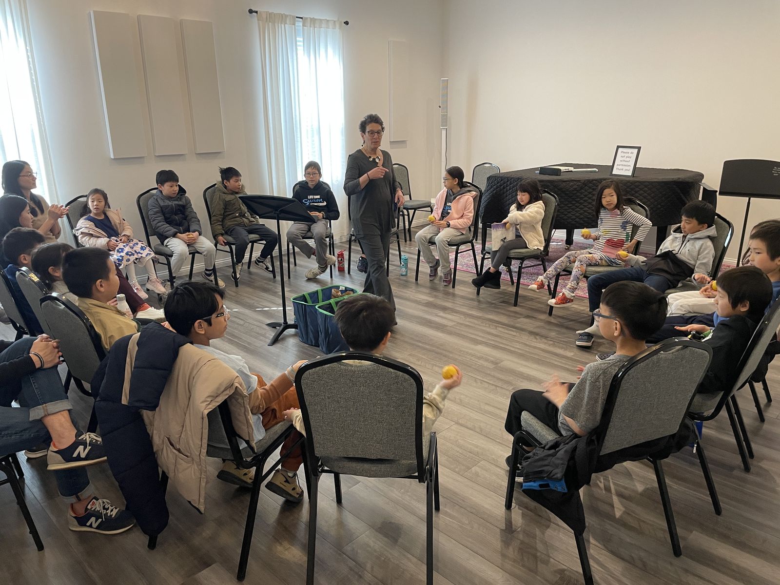Students in a group music class at Musical Moments Music Studio