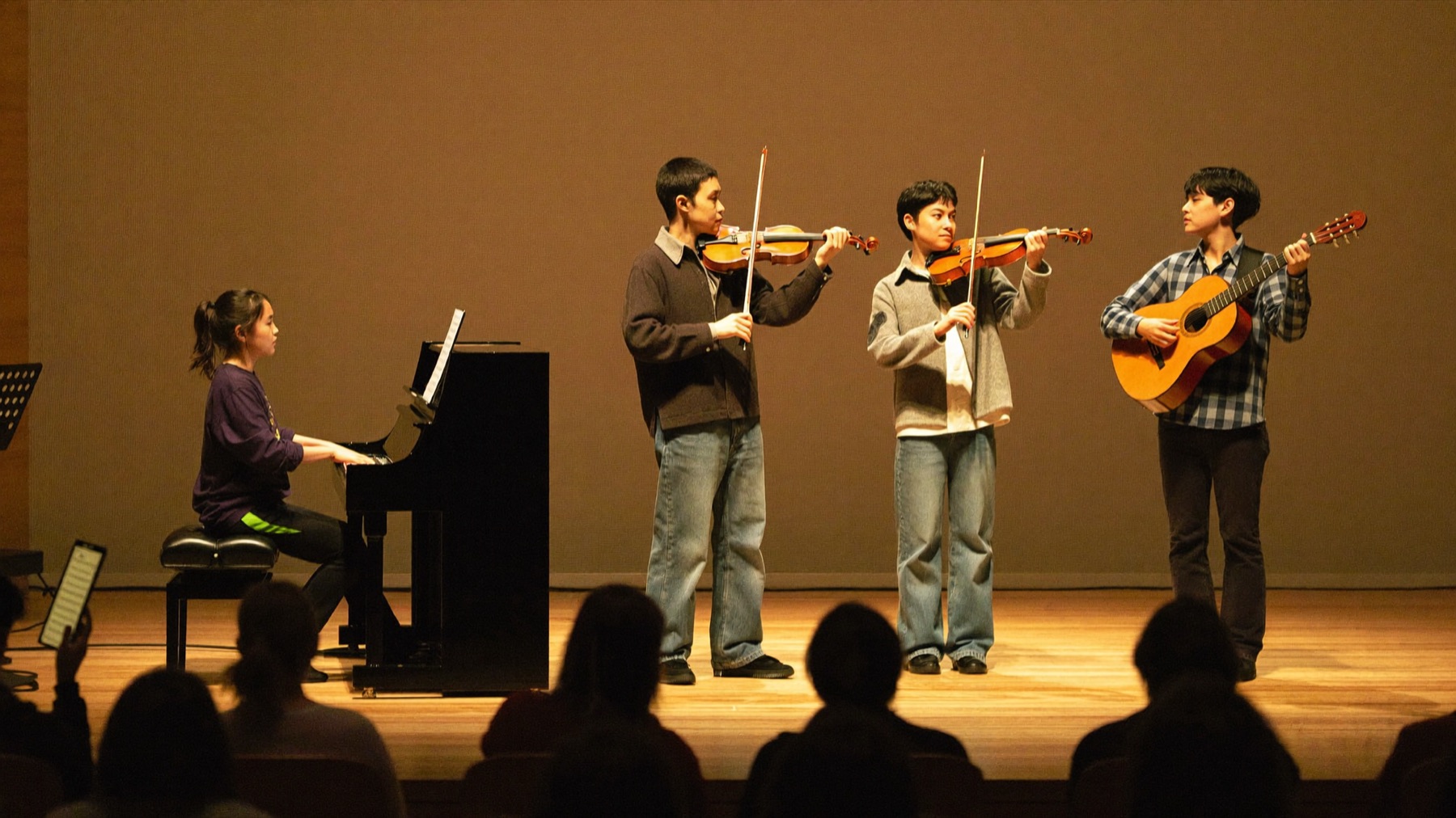 Students performing together at a Musical Moments studio recital